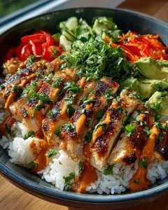 Delicious Bang Bang Chicken Bowl with spicy chicken and creamy sauce.