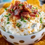Bowl of Cheddar Bacon Ranch Dip with fresh vegetables and chips