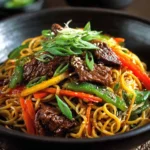 Delicious Sesame Beef Stir Fry garnished with sesame seeds and vegetables