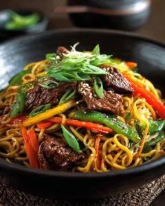Delicious Sesame Beef Stir Fry garnished with sesame seeds and vegetables