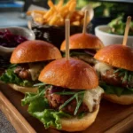 Delicious BBQ beef sliders served on a platter with toppings