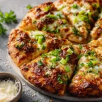 Delicious Buffalo-Style Chicken Pizza topped with spicy chicken and cheese