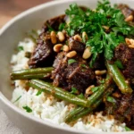 Delicious Middle Eastern beef stew garnished with herbs and spices.