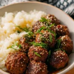 Sweet and spicy Korean BBQ meatballs served on a plate with dipping sauce