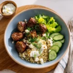 Greek Beef Kofta and Quinoa Bowl served with tzatziki sauce on top