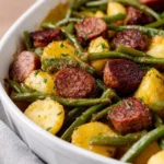 Delicious Sausage Potato Green Bean Casserole served in a baking dish.