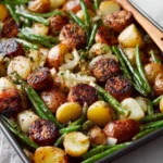 Savory sausage bake with green beans and potatoes in a baking dish