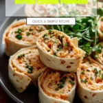 Buffalo Chicken Pinwheels served on a plate with fresh vegetables