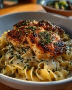 Delicious chicken with buttered noodles served on a plate