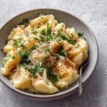 Delicious Easy Tortellini Alfredo served in a bowl with a sprinkle of Parmesan cheese.
