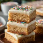 Delicious soft sugar cookie bars topped with colorful sprinkles.