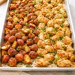 Baked Garlic Parmesan Chicken with roasted potatoes on a plate