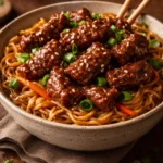 Slow cooker beef ramen noodles served in a bowl with fresh toppings