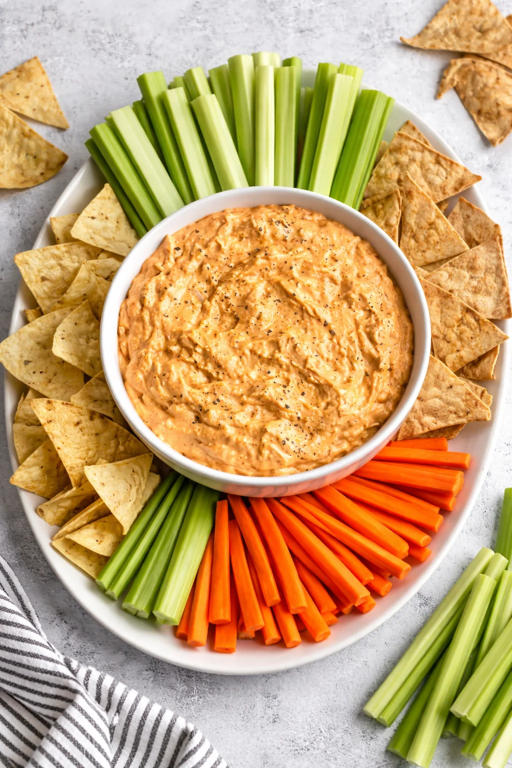 Delicious creamy Buffalo Chicken Dip served in a bowl with chips