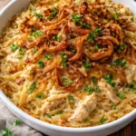 French Onion Chicken Orzo Casserole dish ready to serve, topped with melted cheese.