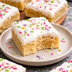 Delicious soft and chewy sugar cookie bars on a plate
