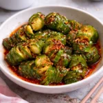 Asian spicy cucumber salad with fresh ingredients in a bowl