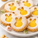 Easter-themed Lemon Linzer cookies decorated with bunny and floral designs.