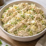 Old fashioned chicken salad with vegetables and creamy dressing served in a bowl