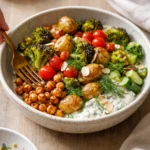Colorful plant-based Mediterranean bowls filled with fresh vegetables and grains.