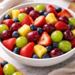 Colorful quick fruit salad made with fresh seasonal fruits.