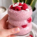 Delicious Raspberry Chia Pudding topped with fresh raspberries and mint leaves