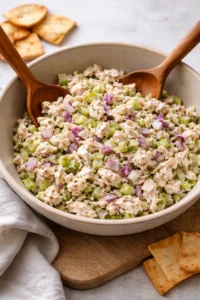 Delicious rotisserie chicken salad topped with fresh greens and dressing