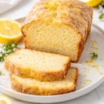 Sourdough discard lemon cake topped with fresh lemon slices and icing