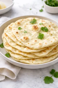 Homemade sourdough tortillas on a wooden surface