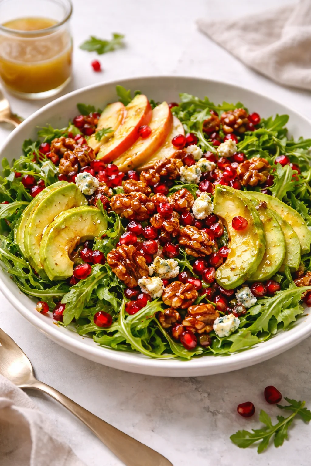 Winter Christmas Salad with Honey Mustard Dressing garnished with festive ingredients