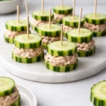 Cucumber tuna sandwiches with fresh ingredients on a plate