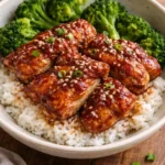 Delicious soy garlic chicken thighs served with a side of vegetables