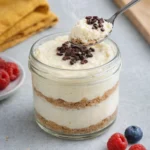 Healthy protein cheesecake jars filled with creamy, nutritious cheesecake layers