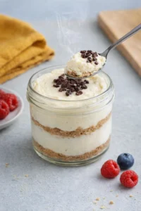 Healthy protein cheesecake jars filled with creamy, nutritious cheesecake layers