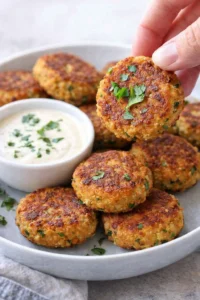 Golden crispy chickpea fritters served with dipping sauce