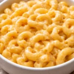 Creamy mac and cheese topped with breadcrumbs, baked to perfection.