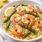 Lemon Garlic Shrimp served with asparagus and orzo pasta on a plate
