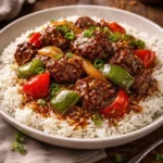 Savory slow cooker pepper steak prepared with vegetables and seasonings