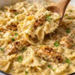 Delicious Chicken Garlic Parmesan Pasta served in a bowl with herbs and cheese.