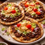 Delicious Smash Burger Tacos topped with special sauce on a serving plate