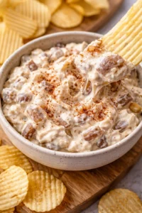 Delicious caramelized onion dip served in a bowl with chips